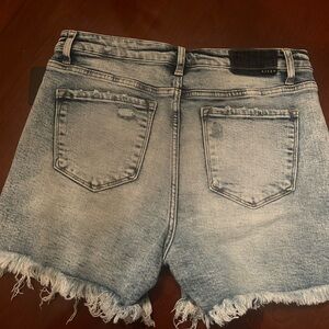 Wild oak boutique. Denim shorts with fringe . Brand new with tags. Size 1XL.